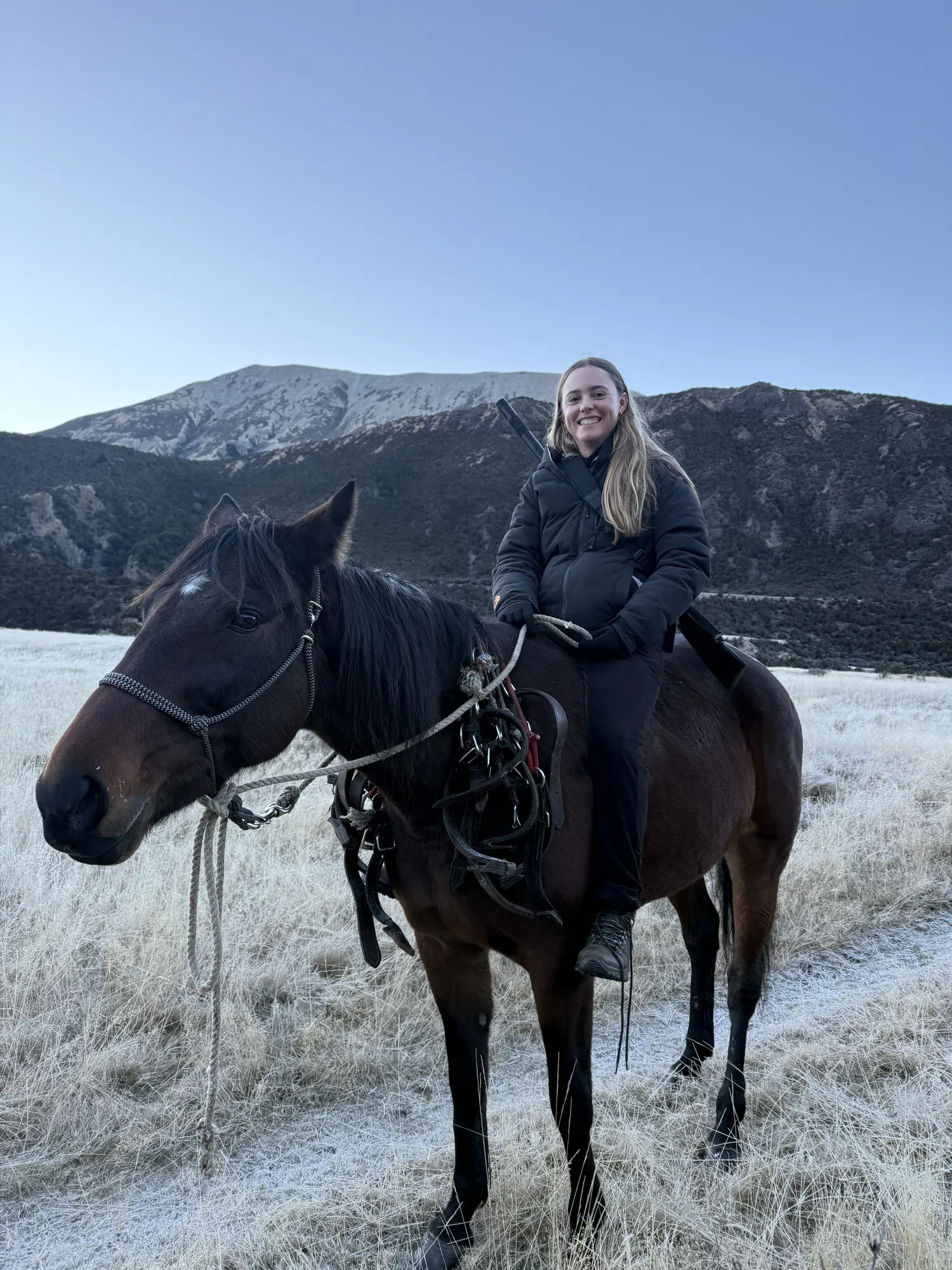 Rider in a down jacket on a frosted morning below the snowline, St James