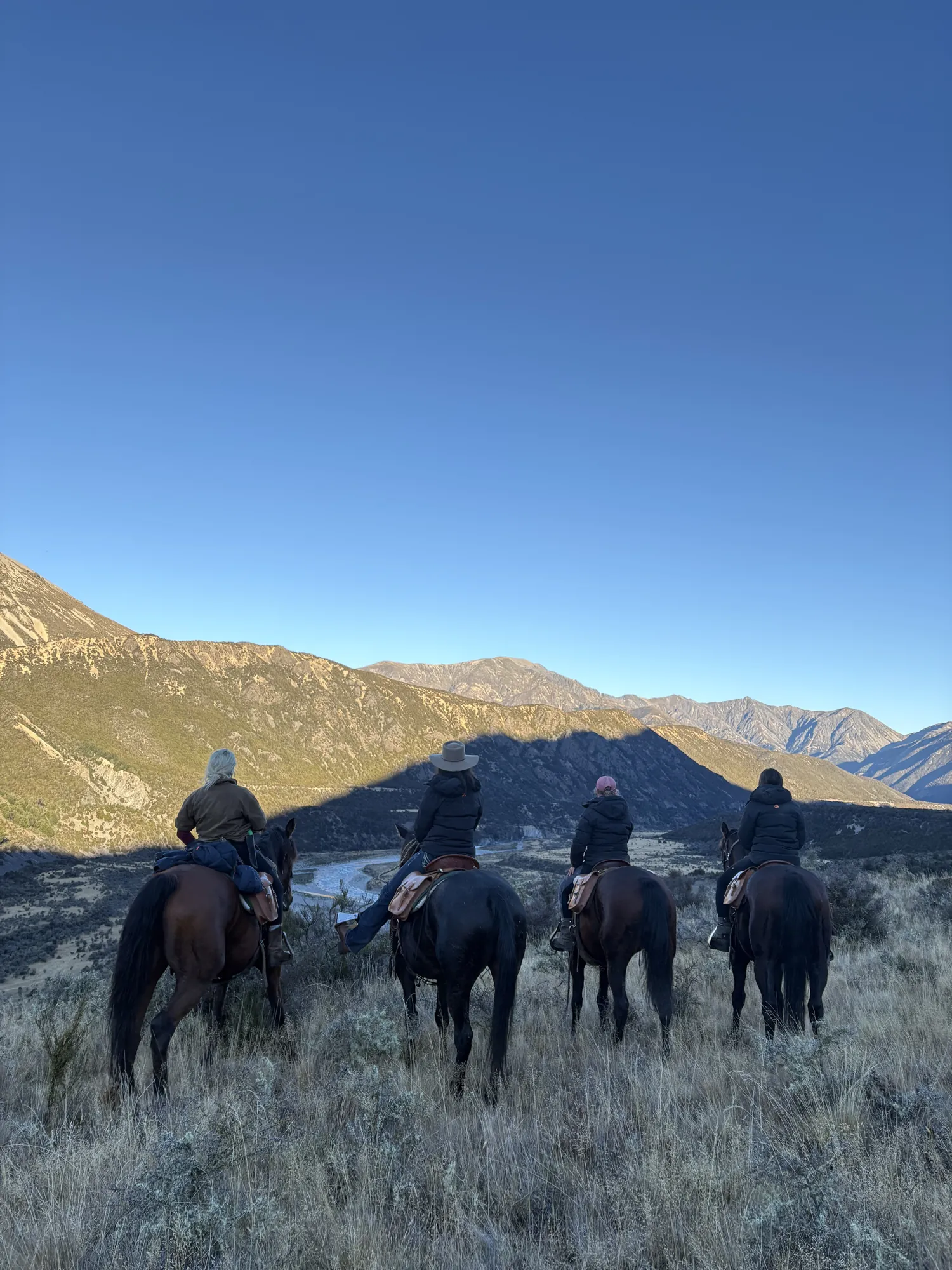 Experienced riders crossing high-country terrain in the St James, New Zealand